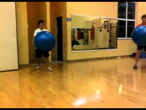 Four Guys Run Into Each Other With Exercise Balls