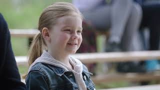  grandfather and granddaughter in the park