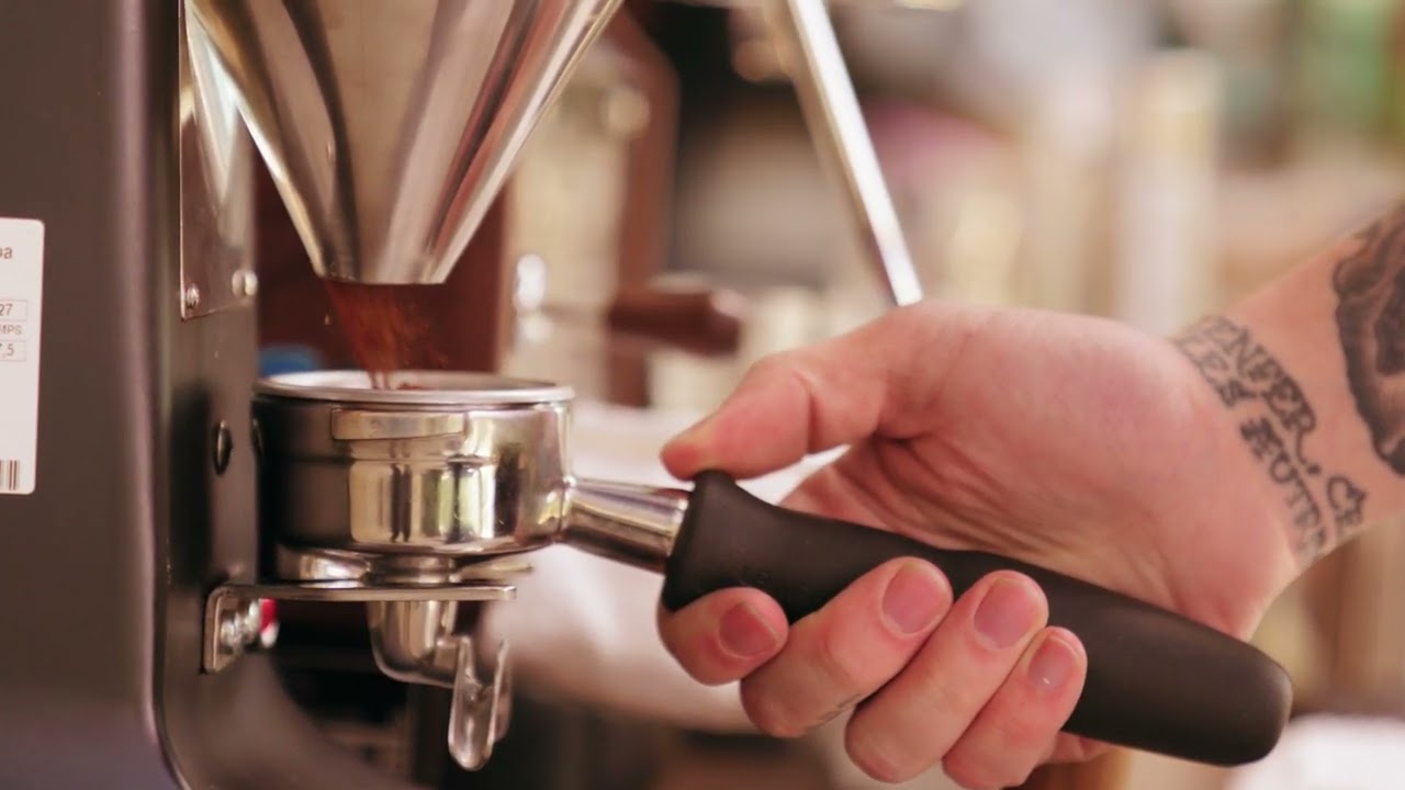 Mesmerizing Free Stock Video | Ground Coffee From A Coffee Bean Grinder Machine | VidStock Hub