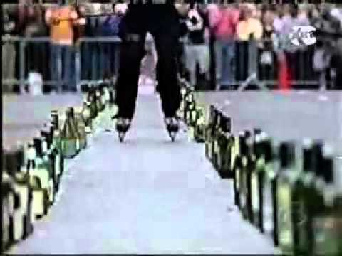 playing mozart on bottles using sticks on rollerblades.mp4