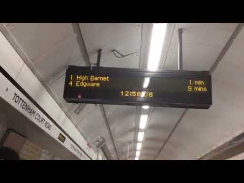 Northern line "STAND BACK TRAIN APPROACHING" sign at Tottenham Court Road