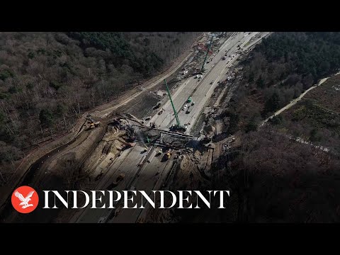 Closed M25 drone footage captures workers demolishing bridge
