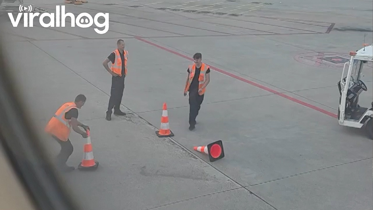 Airport Worker Lands a Perfect Cone Flip || ViralHog