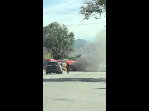 Burning Camaro middle of street