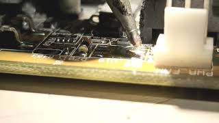 Soldering a small outline integrated circuit (SOIC) unto a motherboard