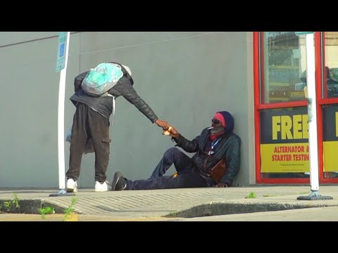 Dropping $1000 In Front of Homeless Guy & Following Him To See What He Does With It!