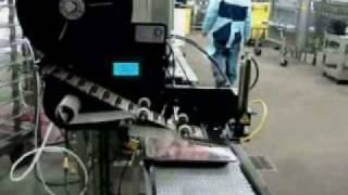 Label Applicator applying labels to case ready meat