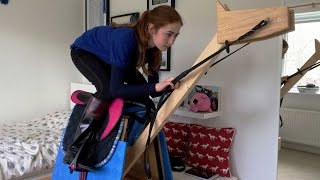Girl Practices Riding On Wooden Horse