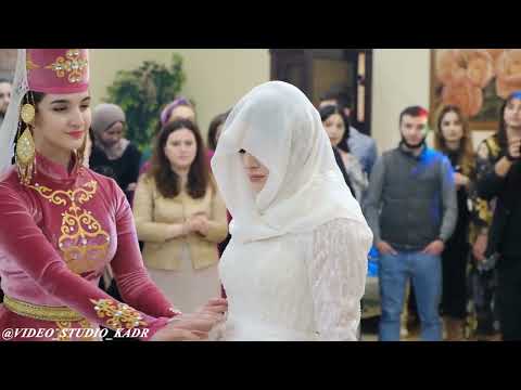 THE CEREMONY OF MEETING THE BRIDE AT A CAUCASIAN WEDDIN