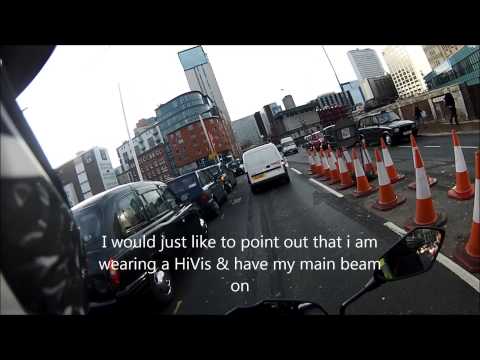 Taxi driver tries to knock off Biker