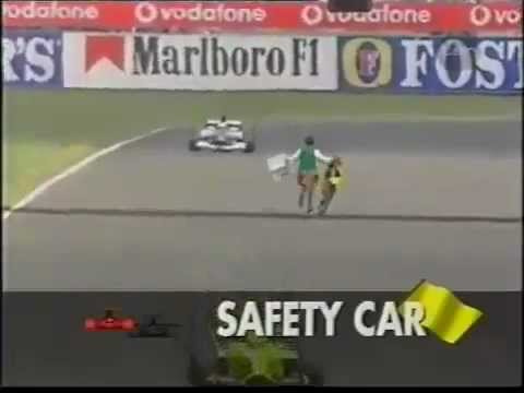 Guy runs onto race track during Formula F1 race!