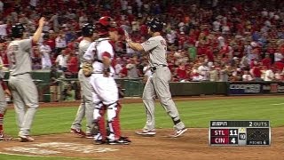 Holliday lifts a grand slam in the 10th