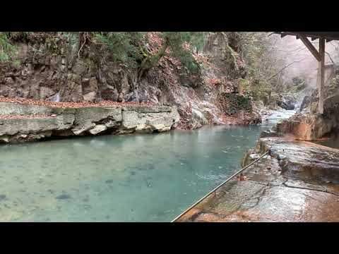 An open-air bath and a river seen from the bath at an Japanese onsen ryokan. (Nasushiobara Onsen)
