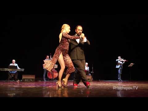  Ekaterina Koptelova  and  Hernan Che  are  dancing  to  a  tango  by  Tango en vivo  in  2018