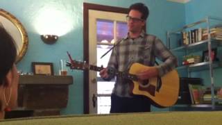 Eef Barzelay at a house show.