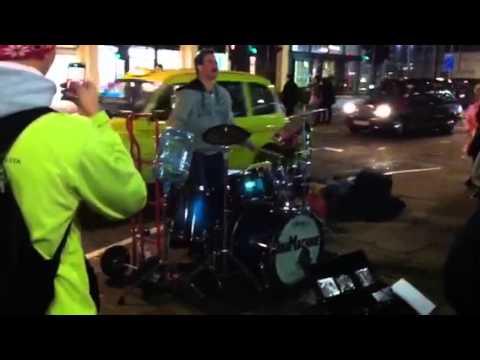 Mad busking drummer outside charring cross