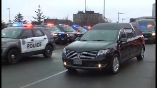 Members of the public, police attend procession for fallen officer