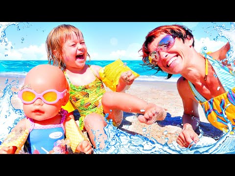 Baby Born doll & baby Bianca swim in the sea - Videos for kids & sand games with baby dolls & toys