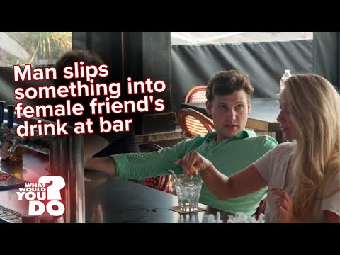 Young man spikes a woman’s drink at a bar