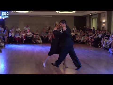  Carlos Espinoza  and  Noelia Hurtado Pitruzzella  are  dancing  to  the  tango  "  Recuerdo  "  by  Osvaldo Pugliese  at  Sunny Tango Festival  in  2019