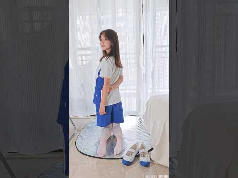 Lingling in a school uniform with white pantyhose and beautiful legs