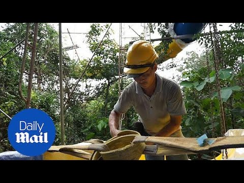 Footage shows workers building the world's longest water slide