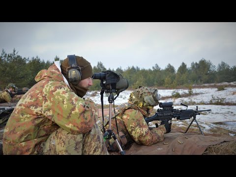 Italian Army Sniper team engage targets during the Advance Marksmanship event as part of the Europe