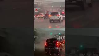 Strong winds lift vehicles at Malaysian toll plaza during thunderstorm, car lands on another vehicle