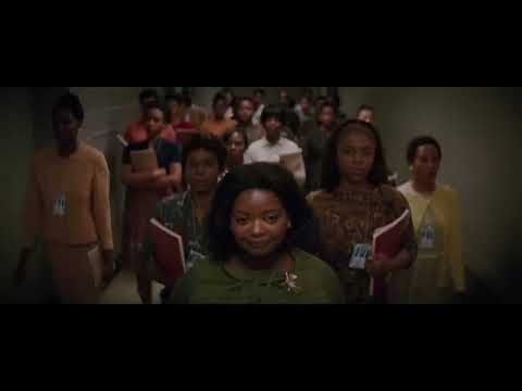Hidden Figures trailer collage—chalkboard math, IBM room, and launch pad—suggesting the score’s mix of piano, choir, and analog pulses