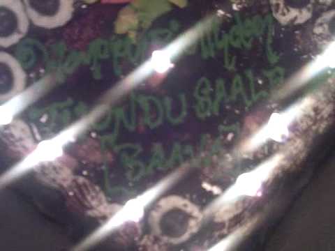 Murali's name on the cake