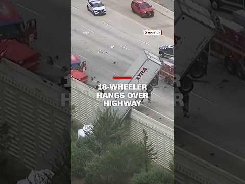 18-wheeler hangs over highway