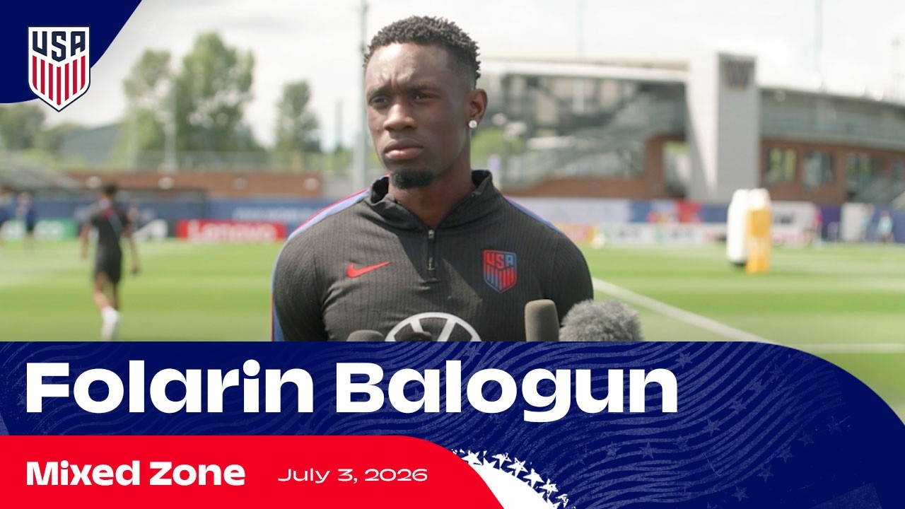 Folarin Balogun speaks to reporters in the mixed zone about his red card and the Belgium match