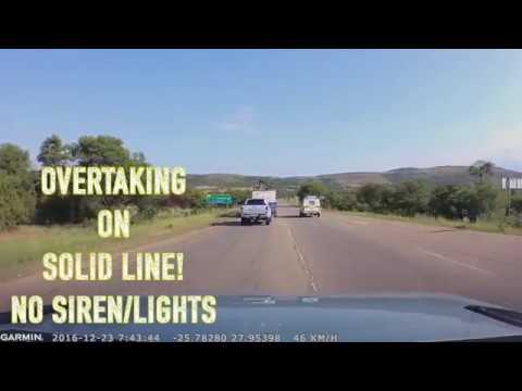 Police Vehicle Overtaking on Solid Line