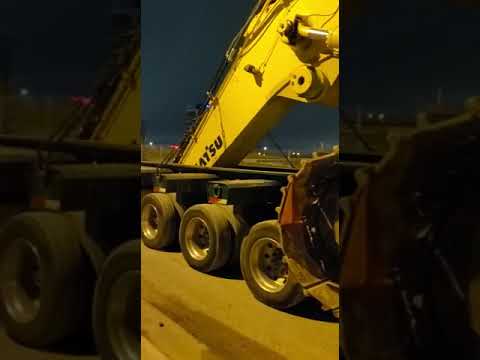 13 axle lowboy transporting a komatsu pc800