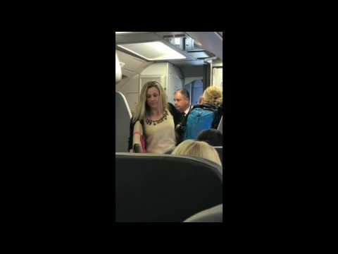 RAW: American Airlines flight attendant says "hit me" to angry passenger