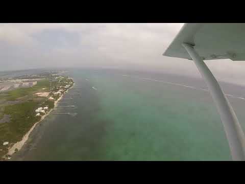 Video thumbnail — Aerial View of Belize Offshore Islands and Landing Rotor Planes (Extended)