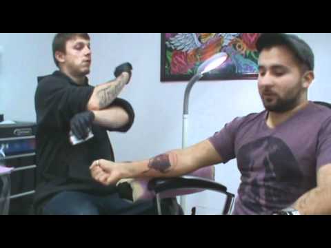Internio gets his cover up tattoo from Screaming Needle
