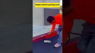 Mastering Precision: Steady Hands Painting Perfect Curbs