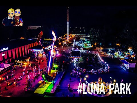 Ethan & Jason at Luna Park carousel in Mamaia