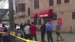 Two women wounded in shootout outside Cleveland liquor store