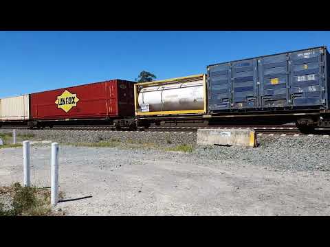 Pacific National's intermodal service 5BM4 (NR88 - NR32 - NR37) races past Glenfield, NSW.