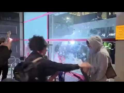 Yobs Smash Windows with a skateboard and the Police station attack continues in Bristol