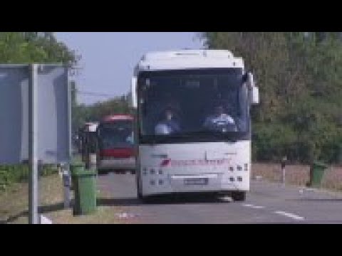 Migrants arrive by bus at Croatia-Hungary border
