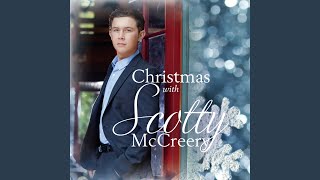 Kadr z teledysku Christmas In Heaven tekst piosenki Scotty McCreery