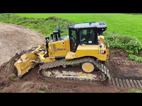 Caterpillar D6 bulldozer pushing topsoil