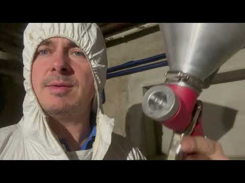 Painting walls with spray method - plaster and painting gun test.
