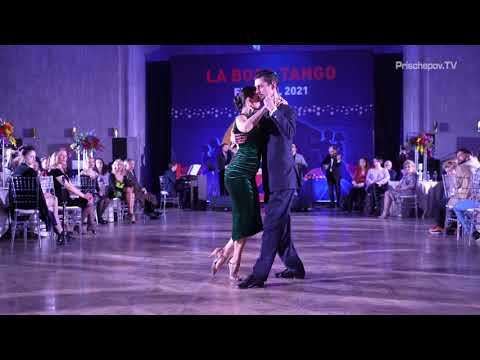  Maxim Luchko  and  Natalia Luchko  are  dancing  to  the  tango  "  Este Es El Rey  "  by  Solo Tango Orquesta  at  La Boca Tango Festival  in  2021