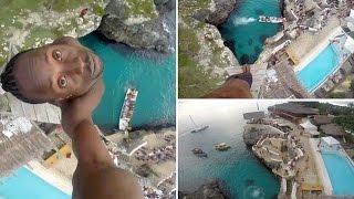 preview picture of video 'Point-of-view shows Jamaican locals make extreme dive at Negril, Jamaica'