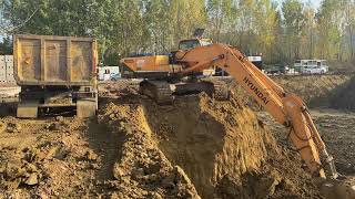 Hyundai 290LC-9 Excavator Loading Mercedes Benz Truck