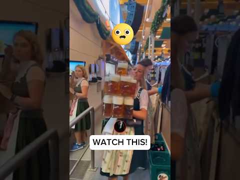 Hot German girl carries 13 mugs of beer!